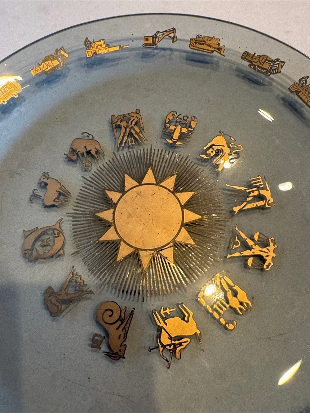 Glass Decorative Plate with Gold Zodiac Accents and heavy equipment